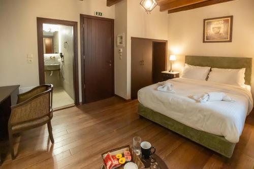 Postel nebo postele na pokoji v ubytování Guesthouse Lousios