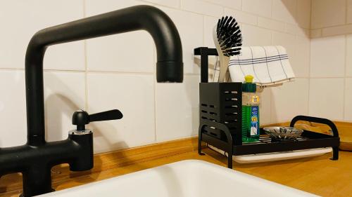 a kitchen counter with a sink and a faucet at Villa Belino in Ruhla