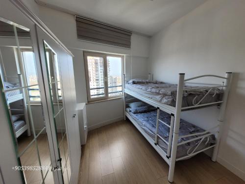 a small room with a bunk bed and a window at Bursa Mount View in Bursa