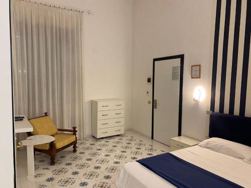Katil atau katil-katil dalam bilik di Hotel Vietri Coast
