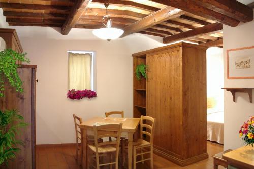 a dining room with a table and chairs at Residence Terre Gialle in Castel del Piano