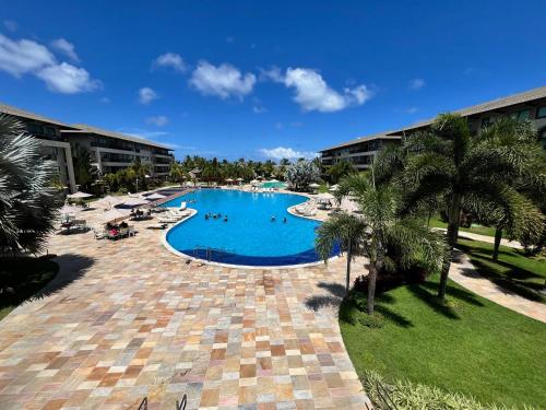 an image of a swimming pool at a resort at Ecolife Térreo frente piscinas in Porto De Galinhas