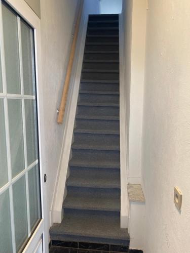 a stairway leading up to a building at Appartement in hartje lier in Lier
