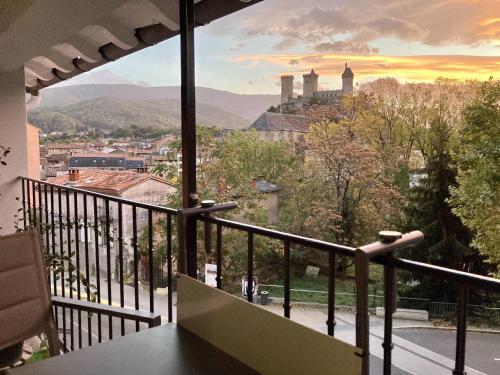 a balcony with a view of a city at Studio Le Roof - Une vue splendide - Petit déjeuner inclus 1ère nuit - AUX 4 LOGIS in Foix