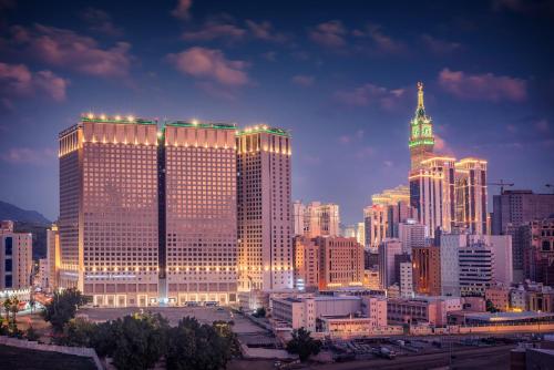 a view of a large city at night at Al Kiswah Towers Hotel in Makkah