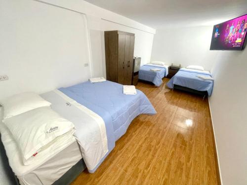 Ein Bett oder Betten in einem Zimmer der Unterkunft ADDA Pacasmayo
