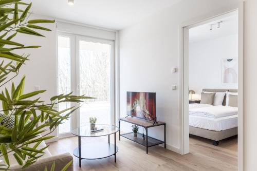 Postel nebo postele na pokoji v ubytování living TIMELESS - Adler Apartments Sasbachwalden