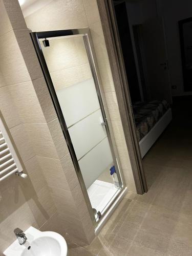 a bathroom with a mirror and a sink at Roby & Simo in San Giorgio a Cremano