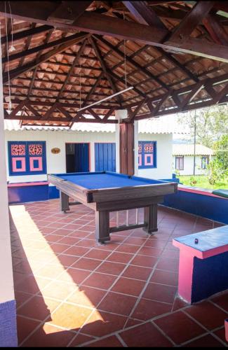 a ping pong table in the middle of a patio at FINCA HOTEL LA BONITA BY LA MACORINA in Quimbaya
