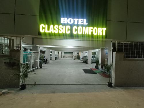 a hotel garage entrance with a sign that reads hotel classic comfort at Hotel Classic Comfort in Bengaluru