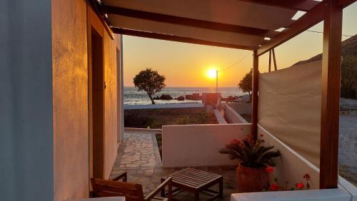 a view of the sunset from the balcony of a house at Villa Patmos Netia - Location Xoxlakas in Patmos