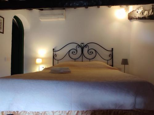 a bedroom with a large bed in a room at Podere I Rovai-apt IL RIFUGIO- in the heart of Tuscany in Reggello
