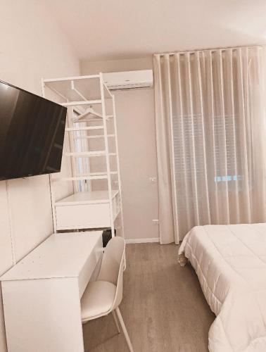 a bedroom with a bed and a bunk bed and a ladder at Midtown Salerno in Salerno