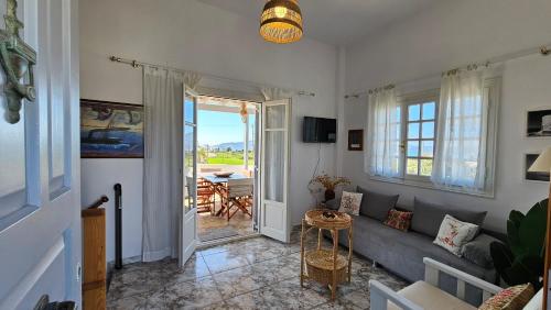 a living room with a couch and a table at Rinio House in Adamas in Mytakas