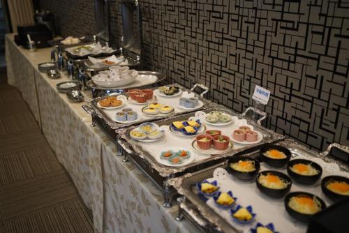 a buffet line with many different types of food at Royal Hotel Uohachi in Toyota