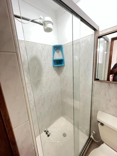 a shower with a glass door in a bathroom at aparta estudio en envigado in Envigado