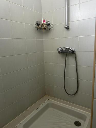 a bathroom with a bath tub with a shower at Gwada dream in Saint-François
