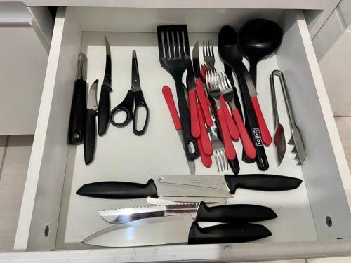 a drawer filled with lots of utensils at promoção novembro na praia de Itanhaém in Itanhaém