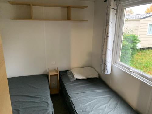 Postel nebo postele na pokoji v ubytování Mobil-Home -10 minutes Océan