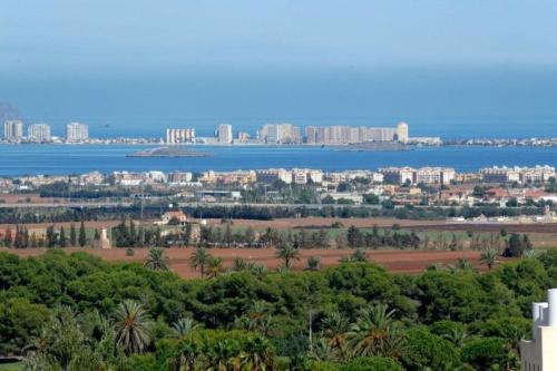 an aerial view of the city and the water at La Manga Club Resort - Los Olivos 68 in Atamaría