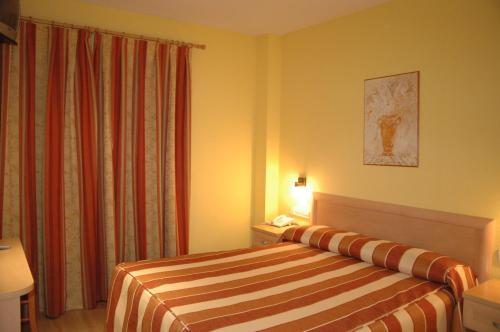 Postel nebo postele na pokoji v ubytování Hotel La Union