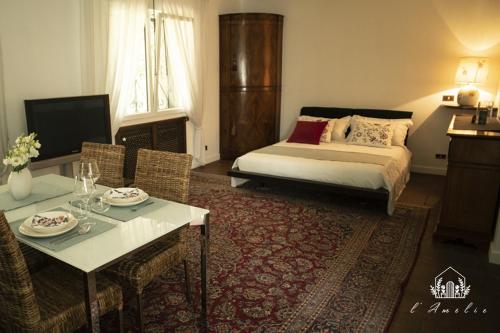 Postel nebo postele na pokoji v ubytování L'AmElie - Elegante Suite