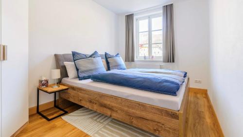 En eller flere senge i et værelse på Traunkai Apartments Bad Ischl