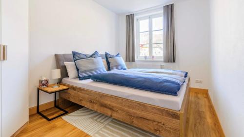 Postel nebo postele na pokoji v ubytování Traunkai Apartments Bad Ischl