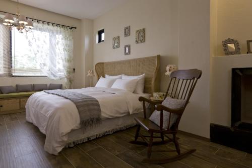 Ένα ή περισσότερα κρεβάτια σε δωμάτιο στο Sunnylands B&B 日光小鎮民宿