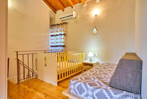 Postel nebo postele na pokoji v ubytování Villa Sanos