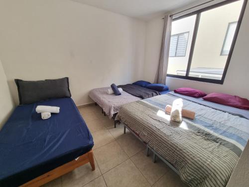 Postel nebo postele na pokoji v ubytování Casa Centrica Amplia con alberca Montejo