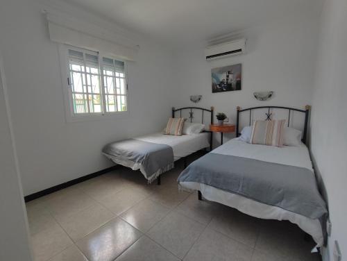 Кровать или кровати в номере splendid bungalow next to dunes