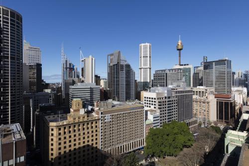 an aerial view of a city with tall buildings at Novotel Sydney City Centre in Sydney