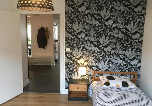 Ένα ή περισσότερα κρεβάτια σε δωμάτιο στο appartement Gilbert