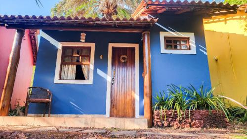 a blue house with a door and a window at Mirante de Lençóis in Lençóis
