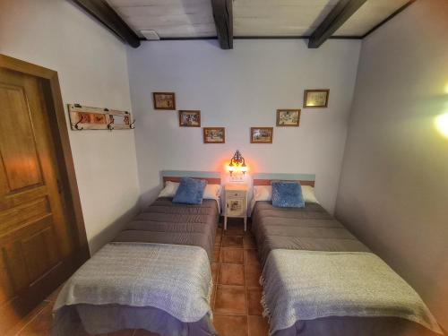 Postel nebo postele na pokoji v ubytování Albergue El Encanto