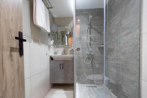 a bathroom with a shower and a sink at Soul Pyramids View in Cairo