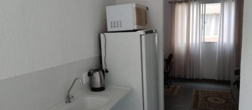 Eldhús eða eldhúskrókur á Apt, espaço inteiro no 1° andar.