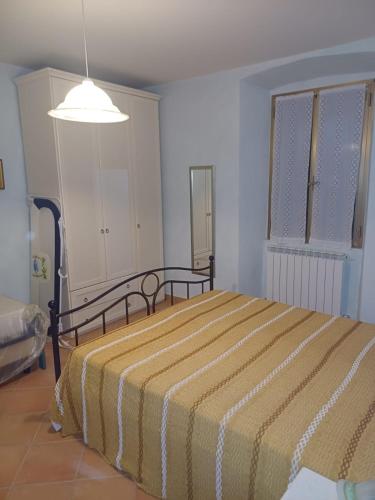 En eller flere senge i et værelse på Casa Graziella
