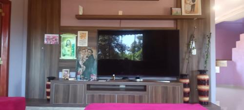 a living room with a large flat screen tv at Ñande renda in Ciudad del Este