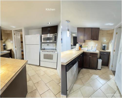 uma cozinha com electrodomésticos brancos e armários castanhos em 2 Bedroom Basement Suite in the heart of Laval em Laval