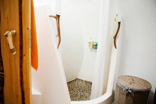 a shower in a bathroom with a shower curtain at Casa Ballena, Finca La Lama Romana Bodonal de la Sierra in Bodonal de la Sierra