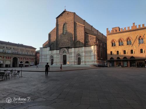 a man standing in a courtyard in a building at B&B San Vitale in Bologna