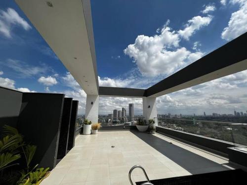 a balcony with a view of a city skyline at Luxury Westlands 2 bedroom Apt (Escada 403) in Nairobi