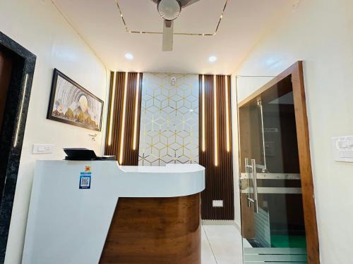 a bathroom with a sink and a shower at Vrindavan Hotel And Restaurant in Sālūmbar