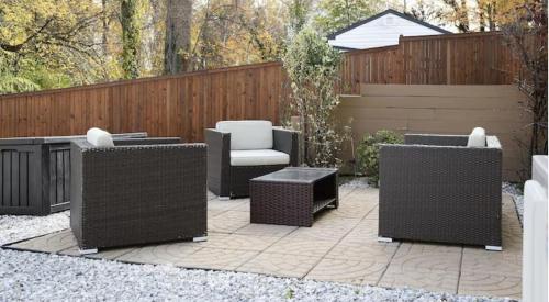 four wicker chairs and a bench on a patio at Bay Ridge unit by Downtown Annapolis and Quiet Waters Park in Annapolis