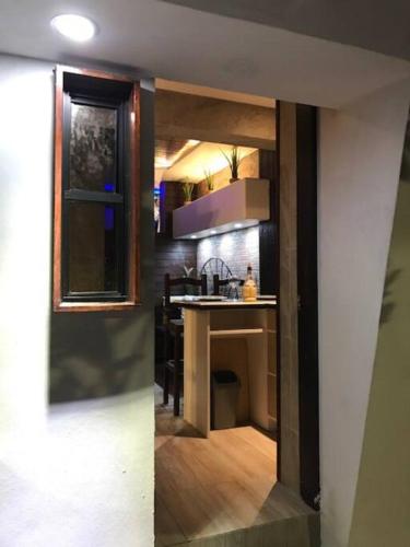 a view of a kitchen with a counter top at Lovely 1 downtown studio in Rosarito