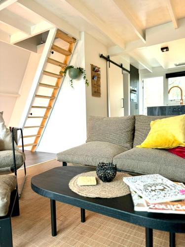 a living room with a couch and a table at A - (frame) - Like A dream in Durbuy