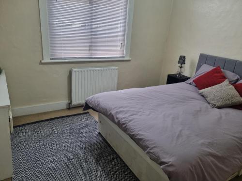 a bed in a room with a window and a bed sidx sidx sidx at Private Rooms in Croydon London in Thornton Heath