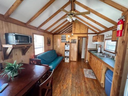 a kitchen and living room in a tiny house at Relaxing Cabin in Bloomington in Bloomington